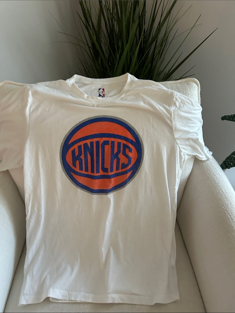 NBA White Tee with Orange and Blue Knicks Emblem